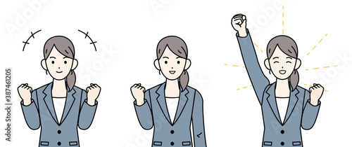 ビジネスウーマン　会社員　スーツ姿の女性　やる気　ガッツポーズ