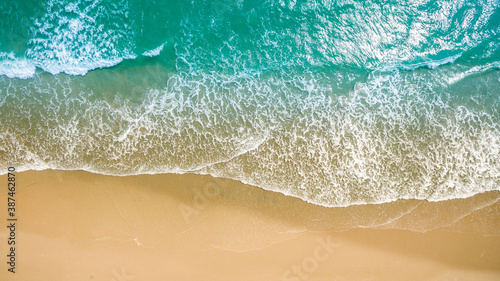 Top view aerial image from drone of an stunning beautiful sea landscape beach with turquoise water with copy space for your text. Beautiful Sand beach with turquoise water, aerial UAV drone shot © kanpisut
