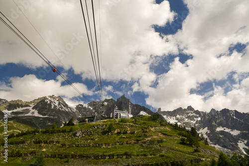 Low-angle view of the Pavillon cable car station (2173 m.a.s.l.) of the Skyway Monte Bianco, that houses a bar/restaurant, a cellar and a conference centre, in summer, Courmayeur, Aosta Valley, Italy