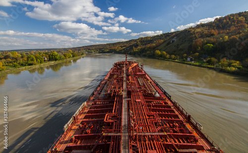 View from the bridge, view from the porthole. Sunset on a river in France, view from the captain’s bridge, view from big ship on river