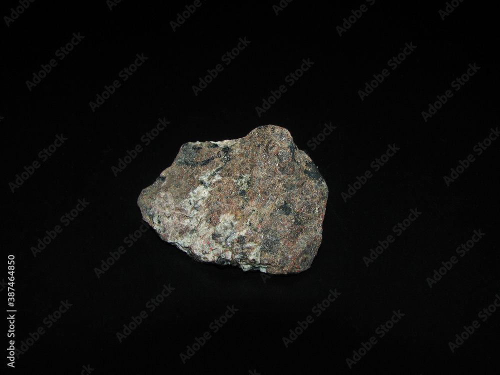 Sample of rock molibdenite on a black background