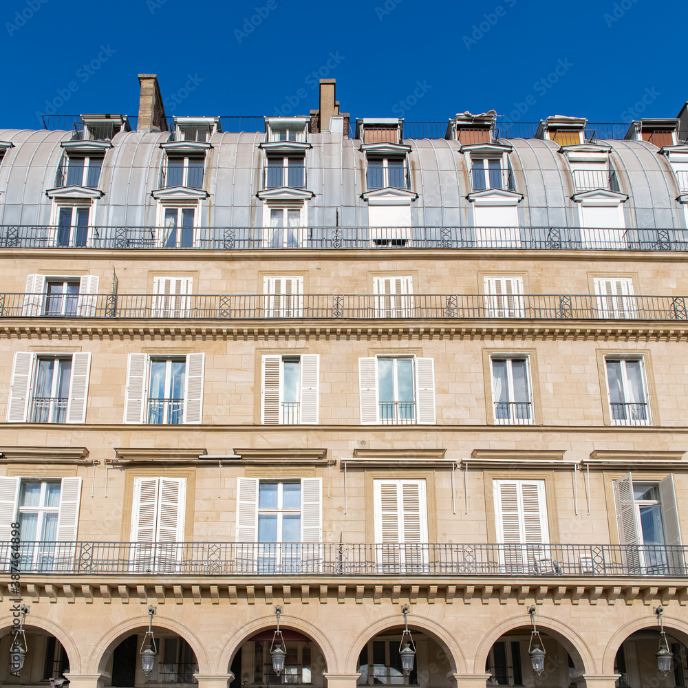 Paris, the beautiful Rivoli street, typical facade and windows
