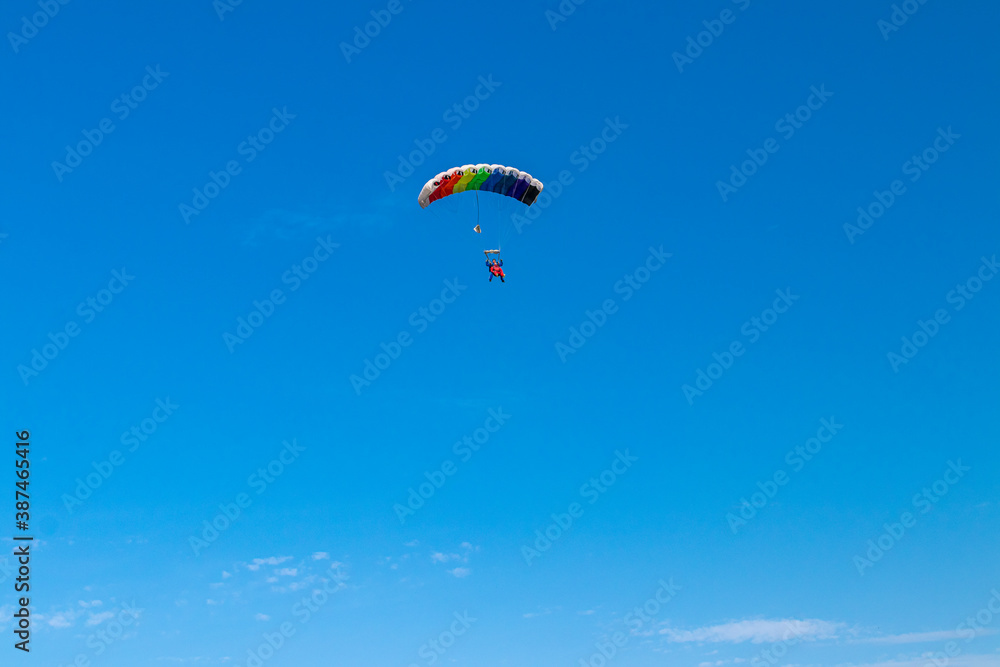 Parachutist is flying in the sky, sunny contrast image. Parachutist is flying in the sky, sunny contrast image.