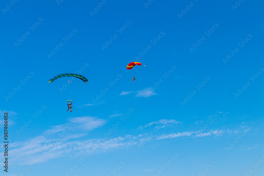 Parachutist is flying in the sky, sunny contrast image. Parachutist is flying in the sky, sunny contrast image.