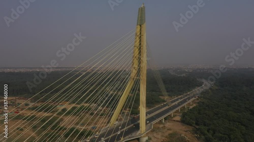 An aerial shot of the Signature Bridge with cars moving in New Delhi, India photo