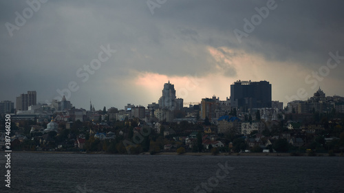 View of the right bank of Voronezh from the North Bridge in the rain