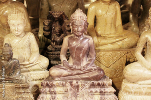 Several sculptures of the contemplating seated Buddha, 3