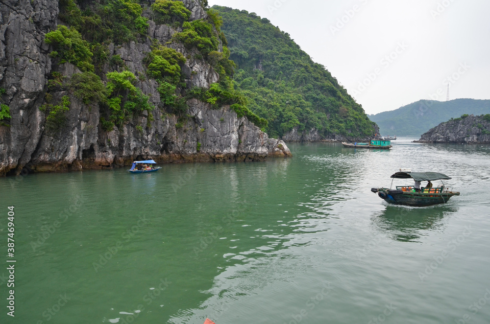 Small boats on the background of rocks. Small boats on the background of rocks.