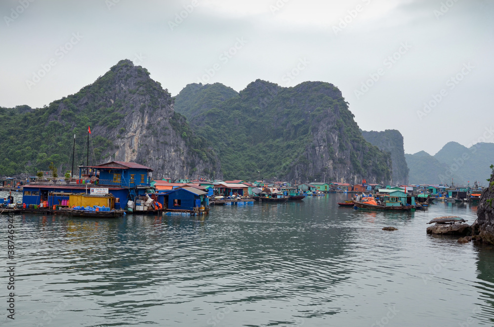A fishing village on the water in Halong Bay.