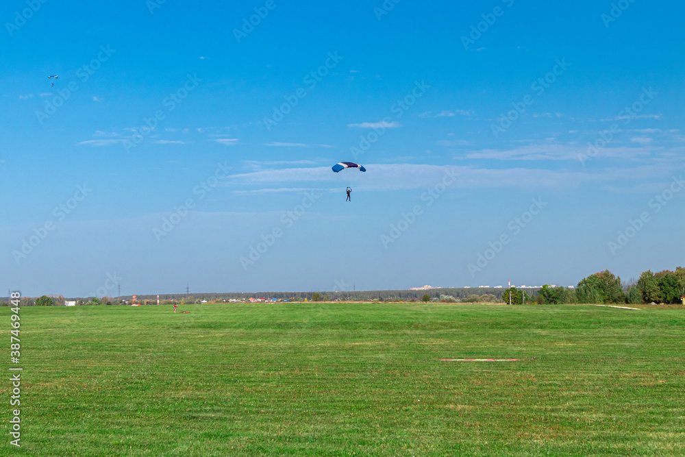 Rarachutist lands on the ground. Rarachutist lands on the ground.