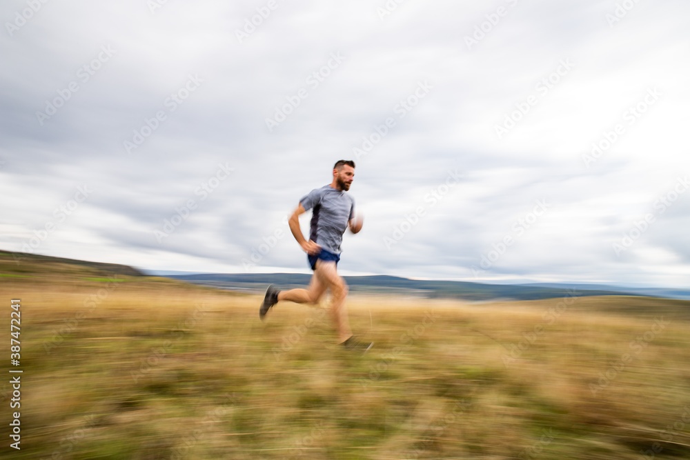 handsome trail runner running in nature handsome trail runner running in nature