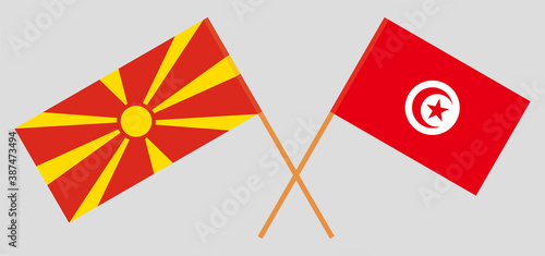 Crossed flags of Tunisia and North Macedonia
