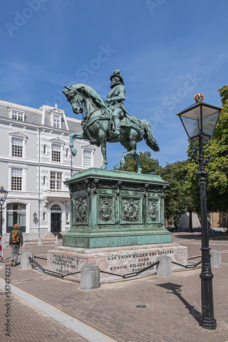 Equestrian statue of Prince William of Orange (1845) on a high pedestal, on which have been placed names of seven regions. The Hague (Den Haag), The Netherlands. photo