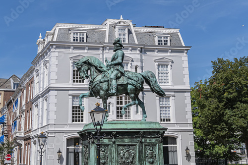 Equestrian statue of Prince William of Orange (1845) on a high pedestal, on which have been placed names of seven regions. The Hague (Den Haag), The Netherlands. photo