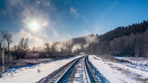 approaching train on railways on foggy and cold morning © Tread-Lite