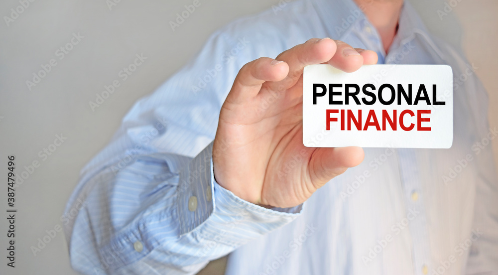 Business man holding a business card. The content of the lettering has implications for business concept and marketing. Business man holding a business card. The content of the lettering has implications for business concept and marketing.