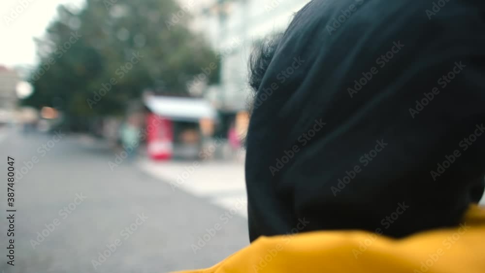 Roundabout woman talking on the phone in the city. He holds the device near his ear with his hand, transmits messages to the interlocutor. Exchange of information using telecommunication. Roundabout woman talking on the phone in the city. He holds the device near his ear with his hand, transmits messages to the interlocutor. Exchange of information using telecommunication.
