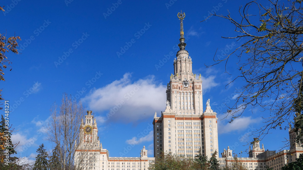 Fototapeta premium Autumn park and sunny campus of old university in Moscow