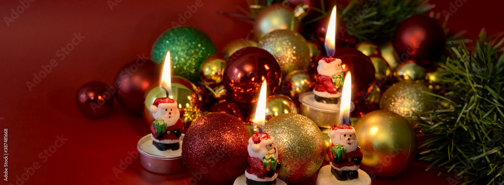 Christmas candle and balls multicolored light. Christmas concept.