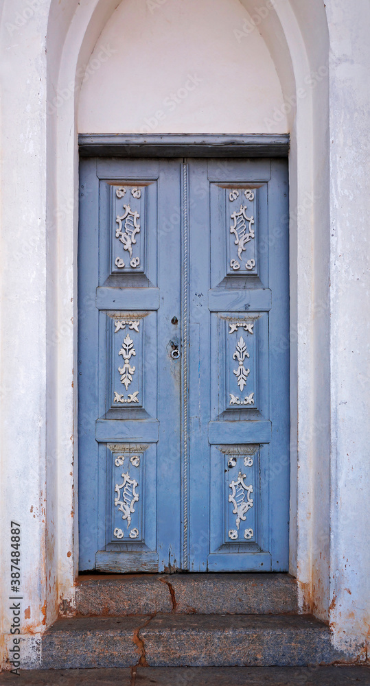 Fototapeta premium Ornate chapel door in historical city of Serro, Minas Gerais, Brazil