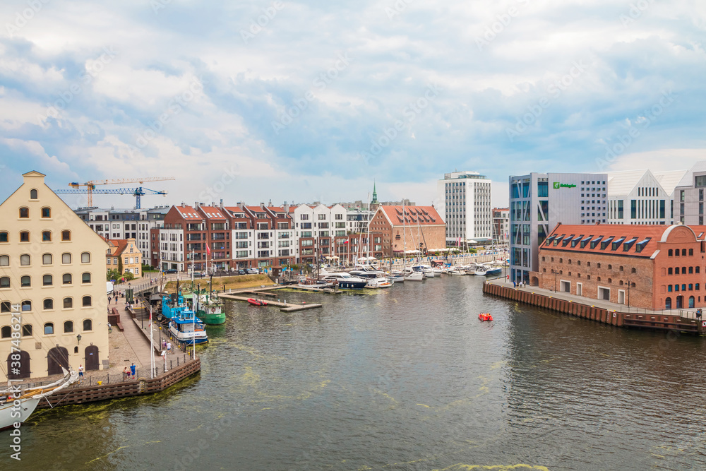 Naklejka premium Gdansk, Poland - 19 June 2020: City of Gdansk (Danzig), Poland. Panoramic view of colourful historic houses in Old Town.
