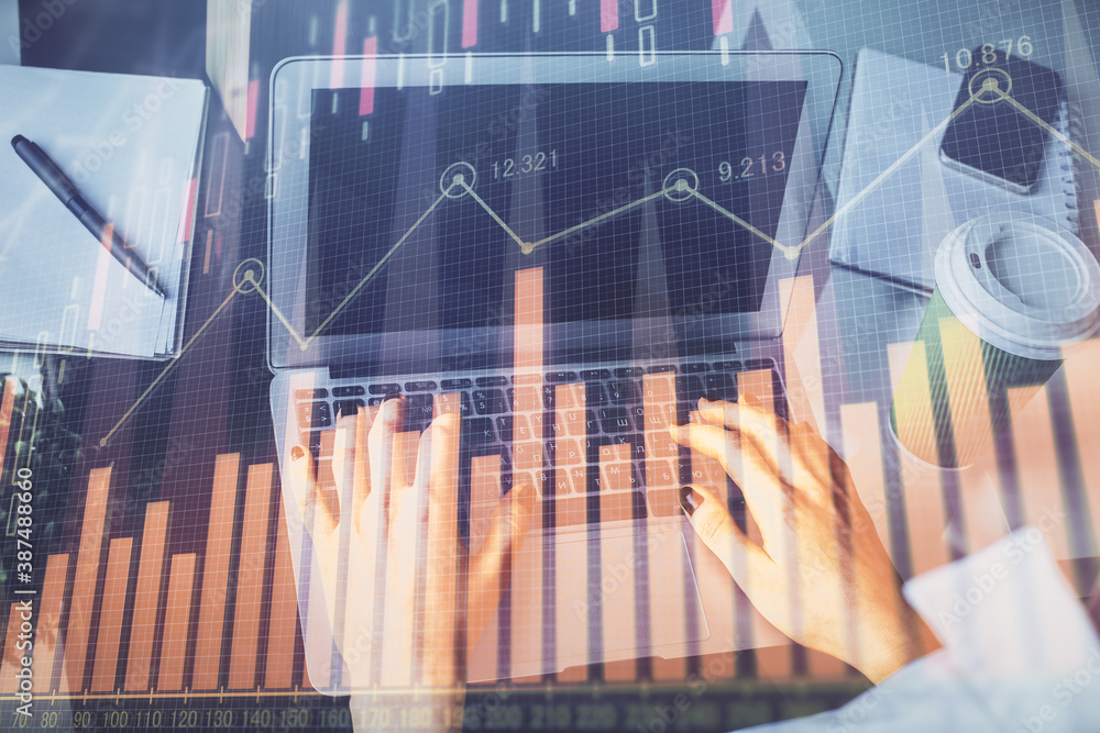 Double exposure of woman hands typing on computer and forex chart hologram drawing. Stock market invest concept. Double exposure of woman hands typing on computer and forex chart hologram drawing. Stock market invest concept.