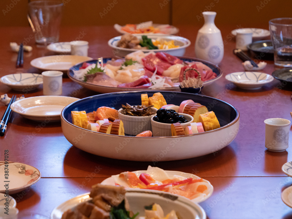 The table being set for a traditional new year's dinner in Japan The table being set for a traditional new year's dinner in Japan