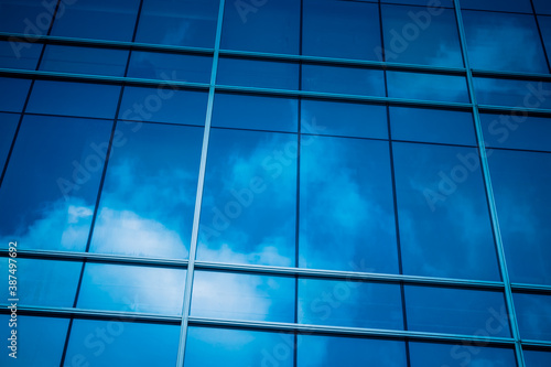 Clouds Reflected in Windows of Modern Office Building.