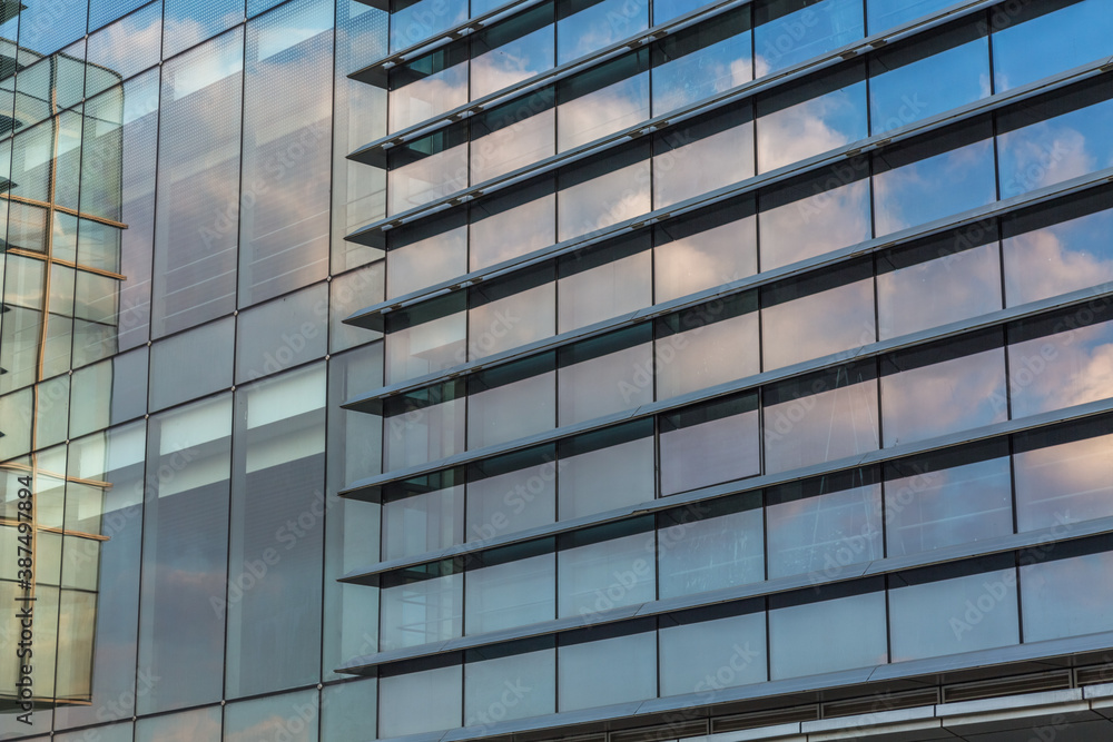 Clouds Reflected in Windows of Modern Office Building.