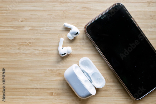 Running gear shot on flat lay, phone, watch and earphone.