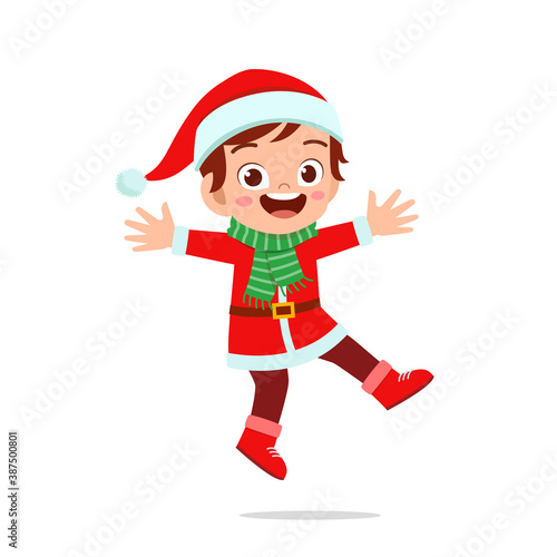 happy cute little kid boy and girl wearing red christmas costume and jump