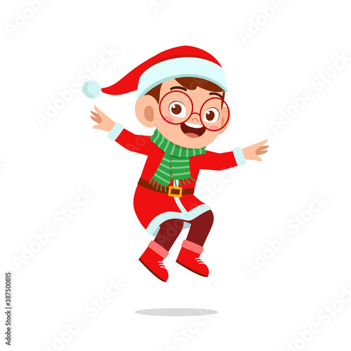 happy cute little kid boy and girl wearing red christmas costume and jump