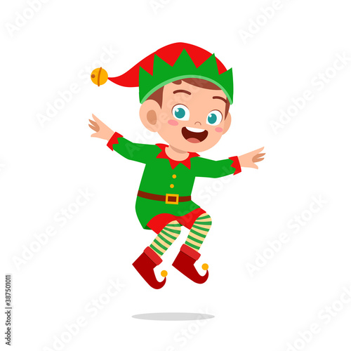 happy cute little kid boy and girl wearing green elf christmas costume