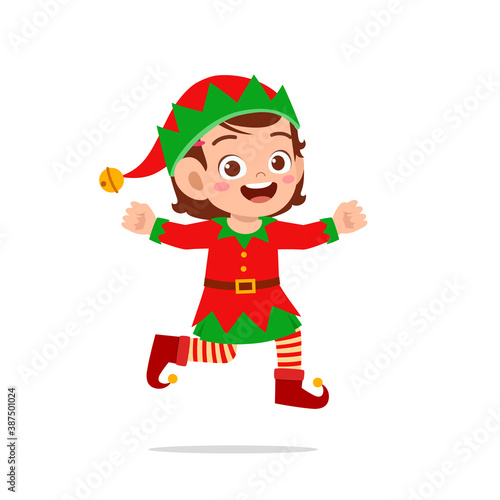 happy cute little kid boy and girl wearing green elf christmas costume