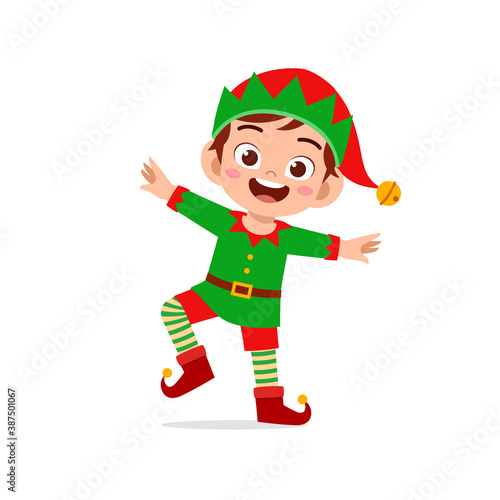 happy cute little kid boy and girl wearing green elf christmas costume