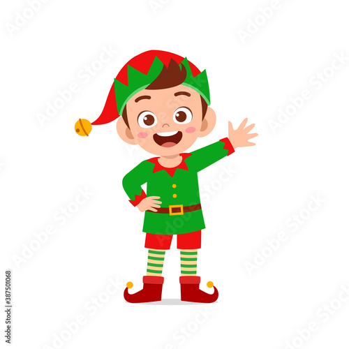 happy cute little kid boy and girl wearing green elf christmas costume