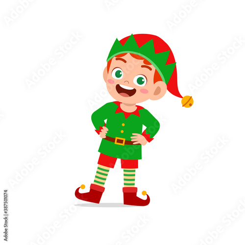 happy cute little kid boy and girl wearing green elf christmas costume