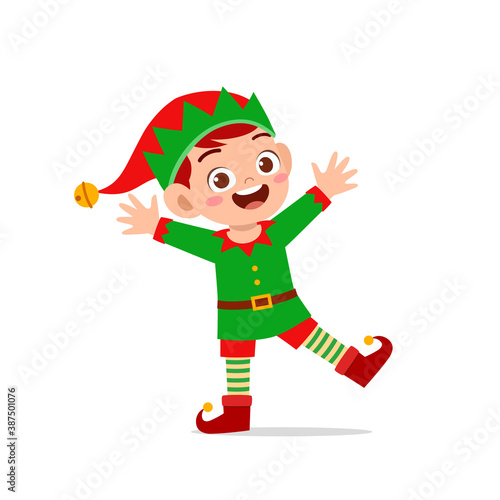happy cute little kid boy and girl wearing green elf christmas costume