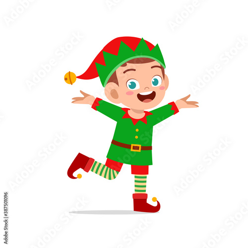 happy cute little kid boy and girl wearing green elf christmas costume © Colorfuel Studio