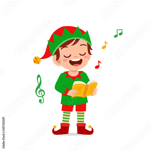 happy cute little kid boy and girl wearing green elf christmas costume and sing a song