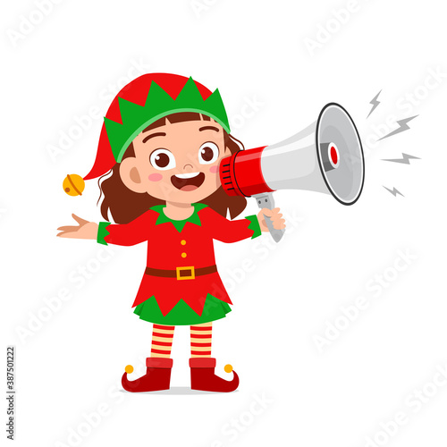 happy cute little kid boy and girl wearing green elf christmas costume and holding megaphone