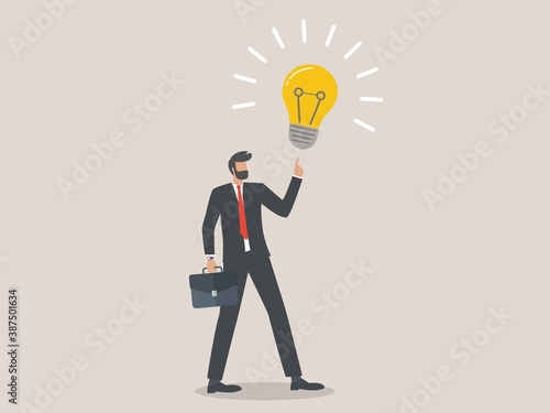 Business idea, smart businessman holding suitcase thinking and got bright lightbulb lamp on his finger, businessman company leader got solution to solve business problem or creativity thinking concept