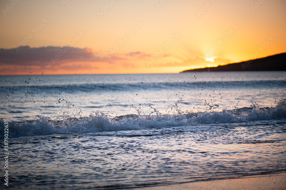 Orange, warm tone sky, Sunset or Sunrise and peaceful waves, Tranquil Landscape Image, dusk or dawn, Hawaii, Maui