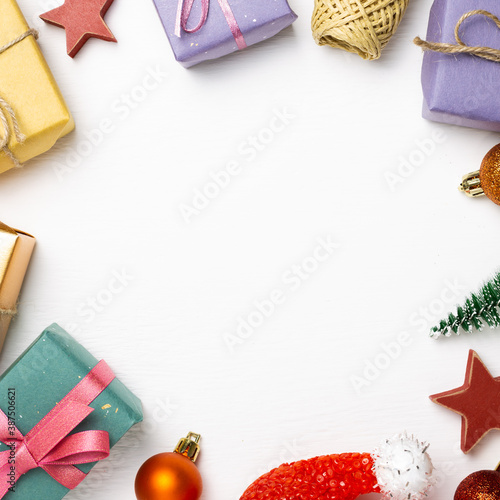 Christmas concept. Gift boxes with fir tree, shiny baubles on white background. flat lay, top view, copy space