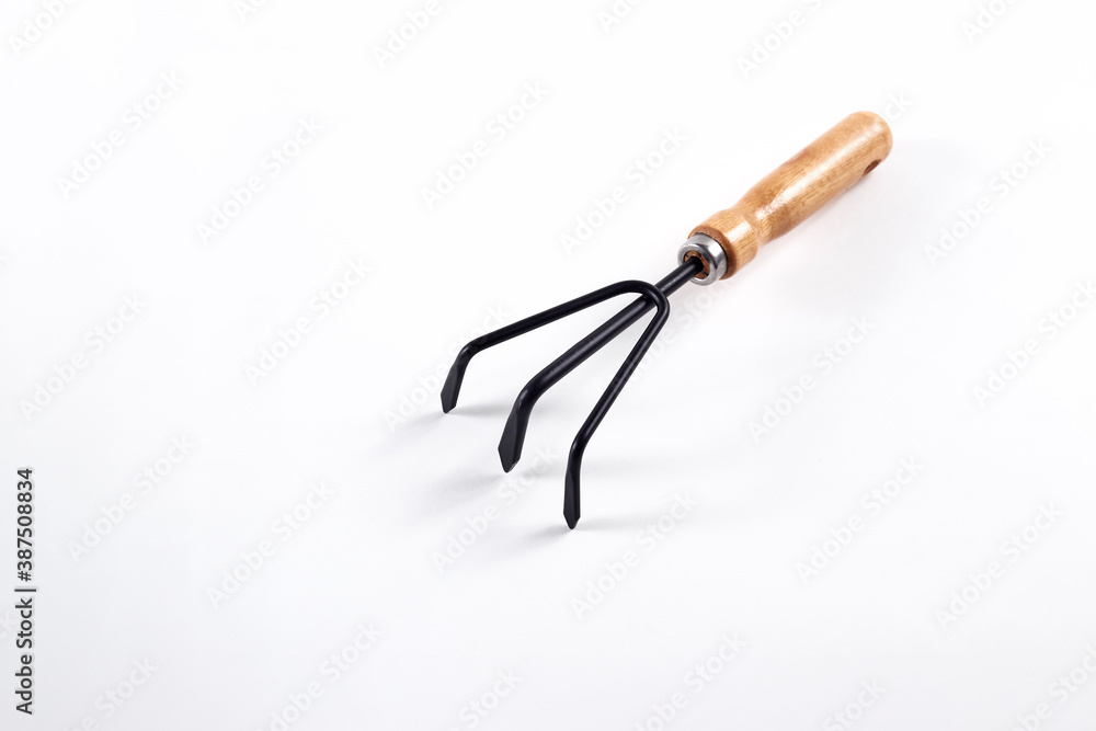 Small gardening fork isolated on white backgroun Small gardening fork isolated on white backgroun
