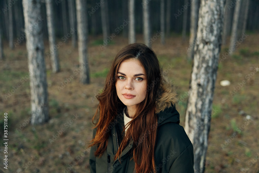 Woman outdoors in the forest near trees outdoors travel Woman outdoors in the forest near trees outdoors travel