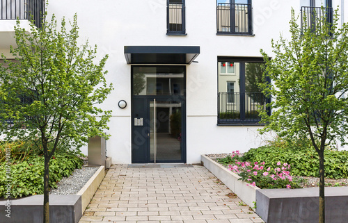 Photography View to entrance door of a modern residential building with new apartments in th