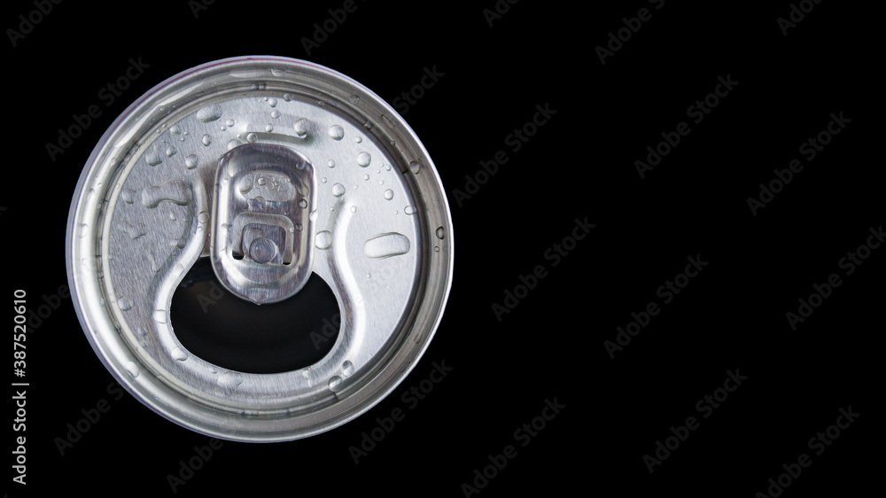 Open metal aluminum can for carbonated drinks, beer, energy drinks and mineral water on a black background. Water drops on an aluminum can. Refreshing drink. A drink with gases. Open metal aluminum can for carbonated drinks, beer, energy drinks and mineral water on a black background. Water drops on an aluminum can. Refreshing drink. A drink with gases.