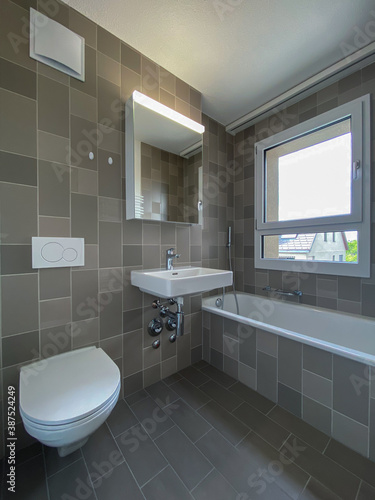 Rental apartment bathroom cleaned and ready for a new tenant to move in - Modern  bright apartment in a city center briging monthly passive  rental income to its owner