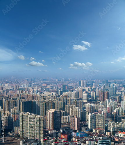 aerial view of Shanghai cityscape and modern skyscraper city in misty sky background behind pollution haze  in Shanghai  China.